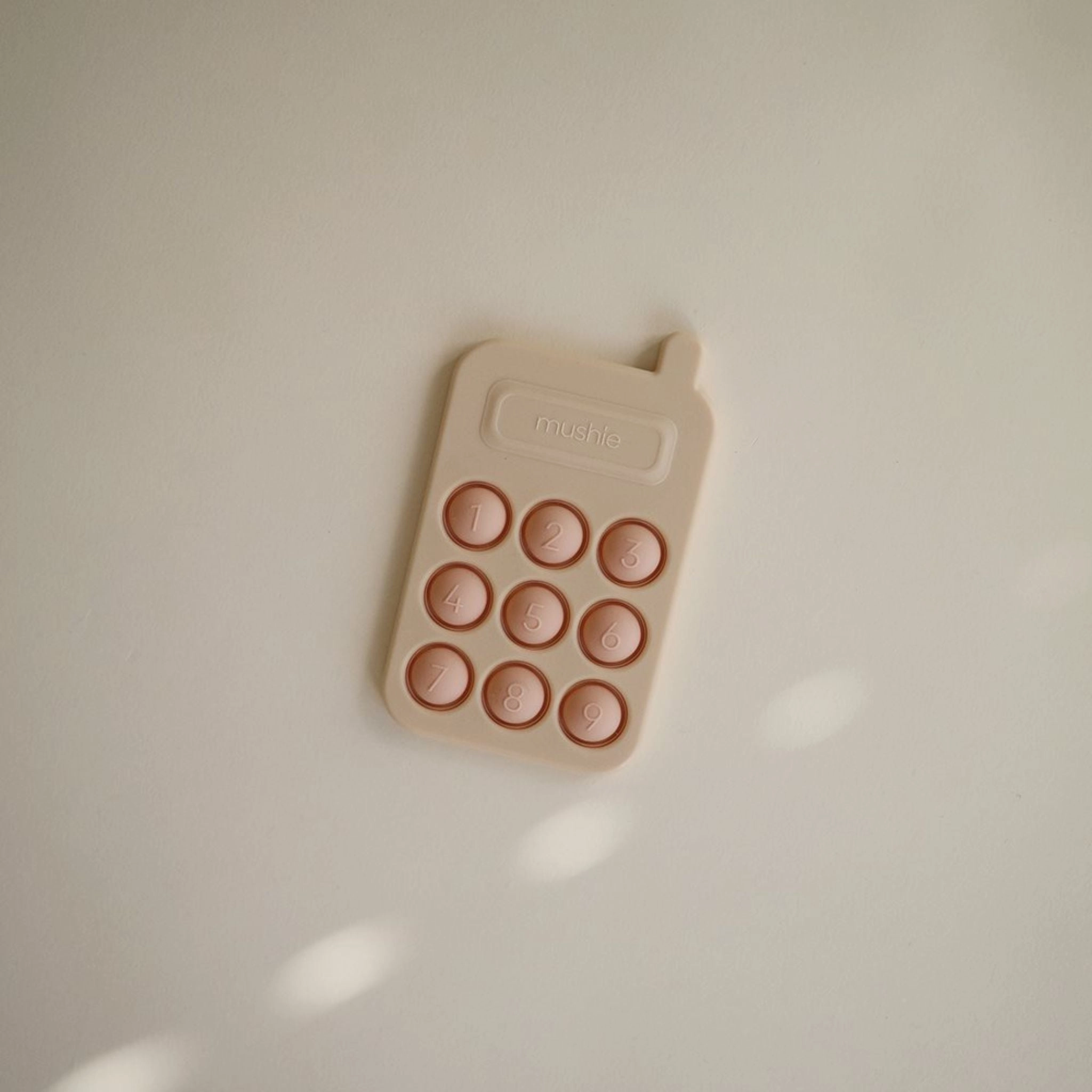 Mushie Phone Press Toy - Blush